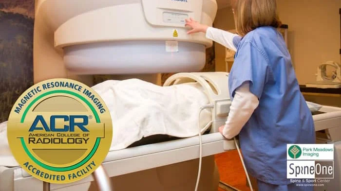 MRI accredition logo in front of image of provider setting up MRI machine