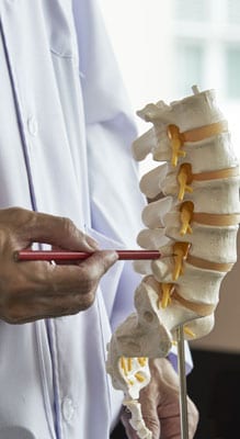 Doctor Showing Spine Injection