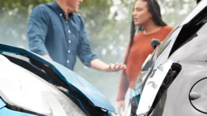 Man and woman argue after a car accident