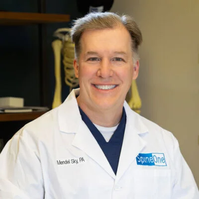 SpineOne physician assistant Mendel Sky smiles